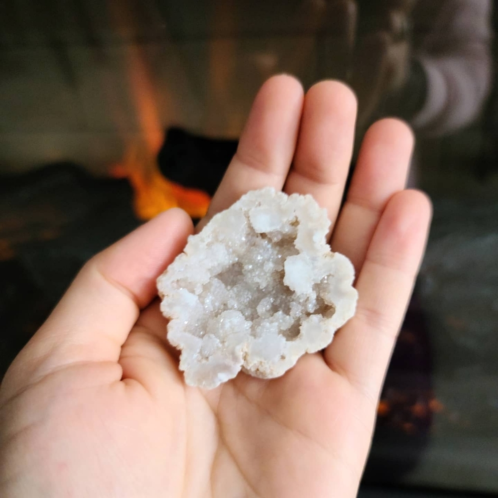 White aura Quartz Geode in a box with description